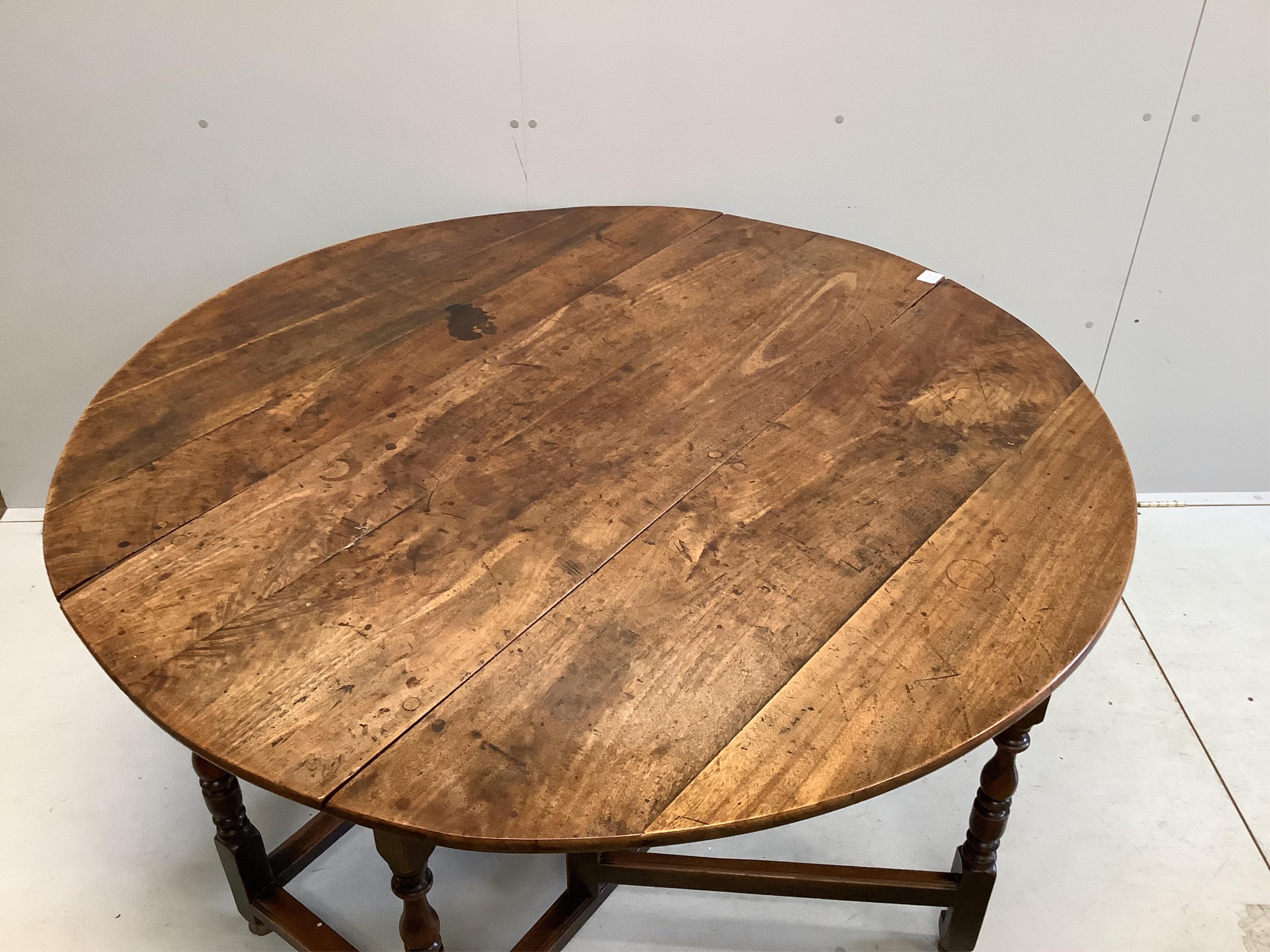 An 18th century mahogany gateleg dining table, 145cm extended, depth 144cm, height 74cm. Condition - fair to good